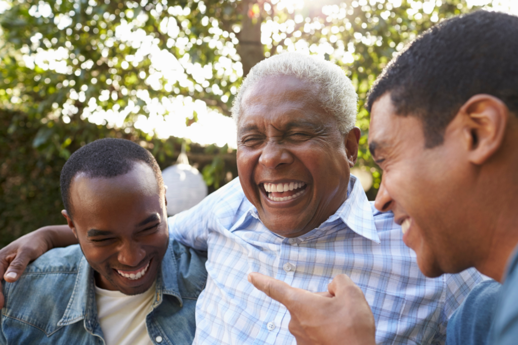 blog-helping-dads-continue-to-live-a-purposeful-life.png - Anthem Lakes Senior Living Senior man embracing with two young men